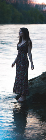Woman standing on rock thoughtful and spiritual.