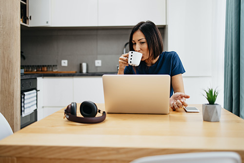 Woman home with laptop coffee Woman home with laptop coffee