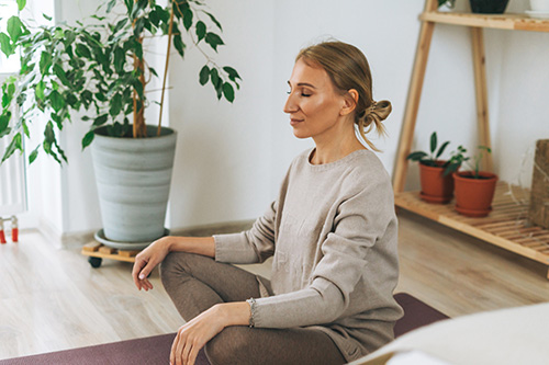 Woman Meditate At Home