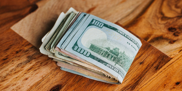 Roll of money on my table. Roll of money on my table.