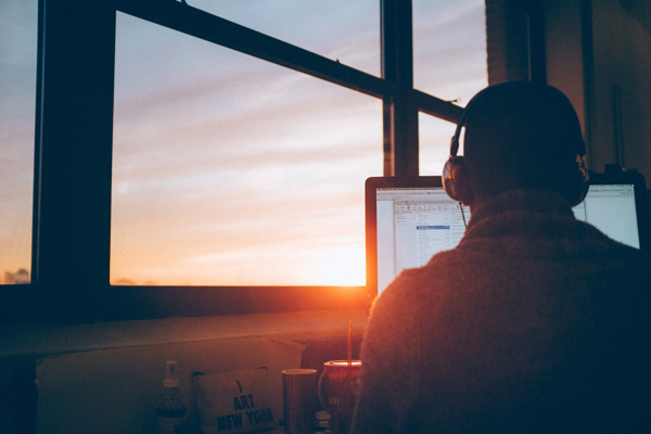 man listening to Amazon Audible in nice home office. man listening to Amazon Audible in nice home office.