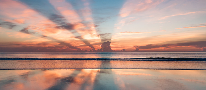 Law Of Attraction. Sunrise filtering across the ocean. Law Of Attraction. Sunrise filtering across the ocean.