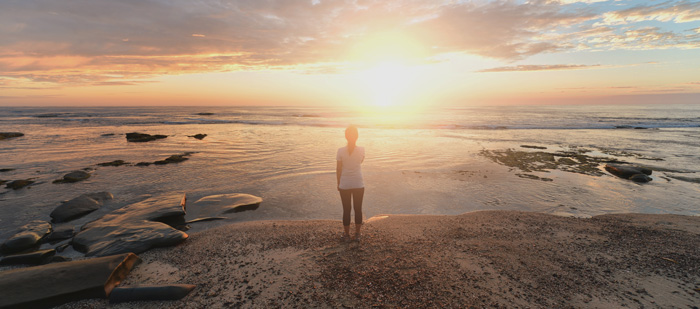law of attraction. Woman manifest at sunrise on beach. law of attraction. Woman manifest at sunrise on beach.