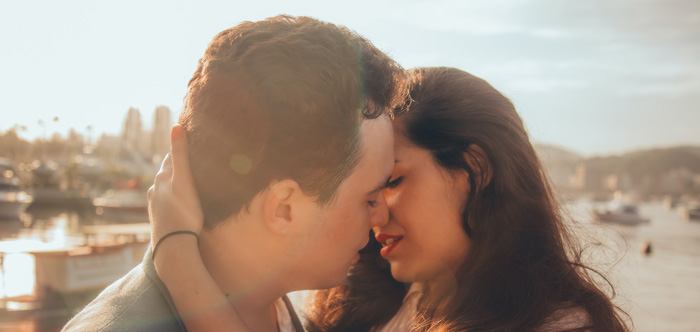 Handsome couple kiss nicely outdoors. Handsome couple kiss nicely outdoors.