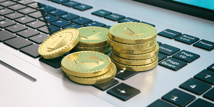 Gold coins and laptop cryptocurrency.