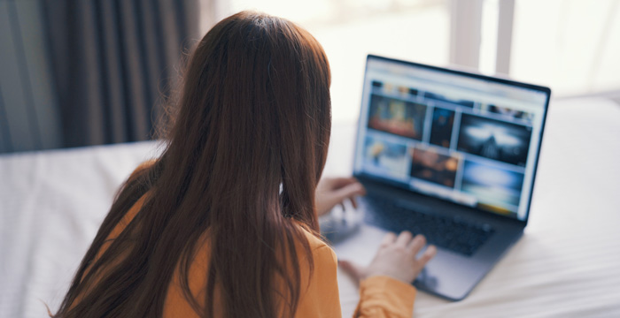 Young woman using InVideo to make money by editing. Young woman using InVideo to make money by editing.