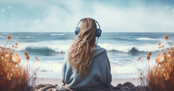 Young woman at ocean with headphones increase theta brain waves with binaural beats. Young woman at ocean with headphones increase theta brain waves with binaural beats.