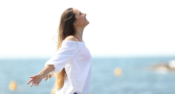 Woman thankful near ocean. Spirituality and making money. Woman thankful near ocean. Spirituality and making money.