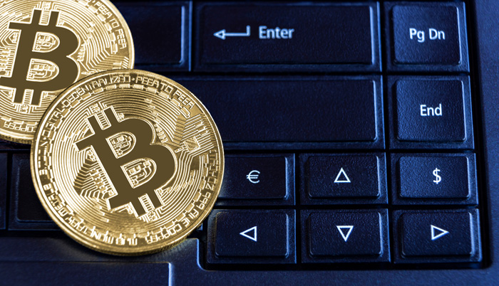 Maximizing profits with the Crypto Ultimatum System. Blue keyboard and gold Bitcoins. Maximizing profits with the Crypto Ultimatum System. Blue keyboard and gold Bitcoins.