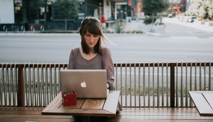 Woman at outdoor cafe. Entrepreneur who is using numerology for career choices. Woman at outdoor cafe. Entrepreneur who is using numerology for career choices.