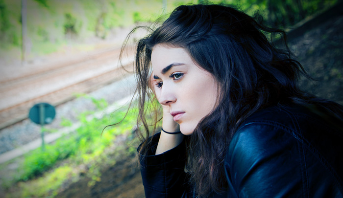 Depressed dark-haired woman. Ghosted and Breadcrumbed. Depressed dark-haired woman. Ghosted and Breadcrumbed.
