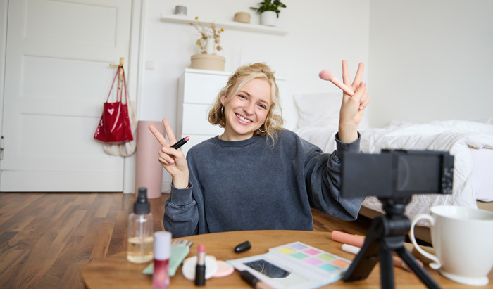 Young video creator using the best vlogging camera for live streaming. Young video creator using the best vlogging camera for live streaming.