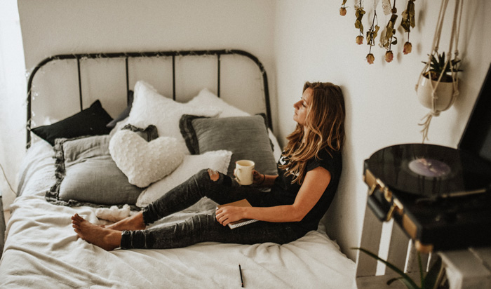 Woman depressed in her bedroom. Ghosted and Breadcrumbed review. Woman depressed in her bedroom. Ghosted and Breadcrumbed review.