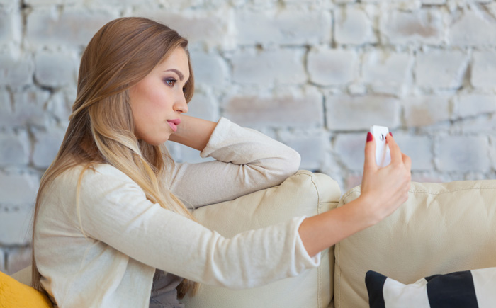 A young woman fights lonliness and depression. Social media comparison and mental health issues are real. A young woman fights lonliness and depression. Social media comparison and mental health issues are real.
