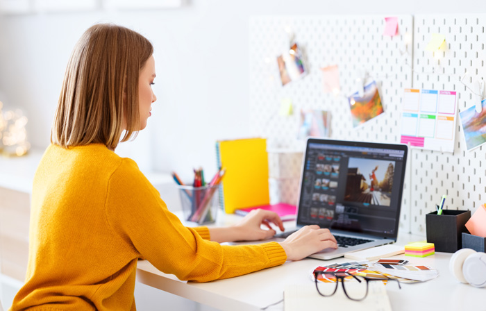 Young woman making Oney with InVideo editing software. Young woman making Oney with InVideo editing software.