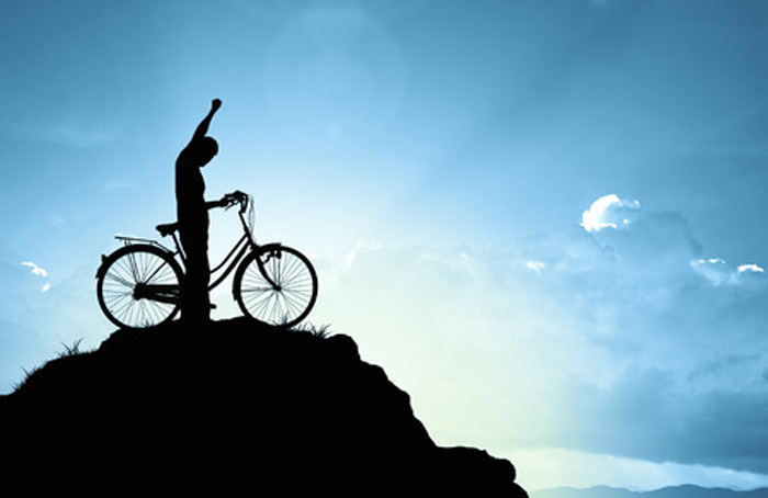 Create your future with your future. Man celebrate biking to top of hill. Silhouette. Create your future with your future. Man celebrate biking to top of hill. Silhouette.