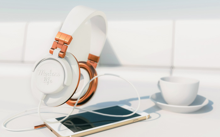 White luxury headphones with coffee and an iPhone. White luxury headphones with coffee and an iPhone.