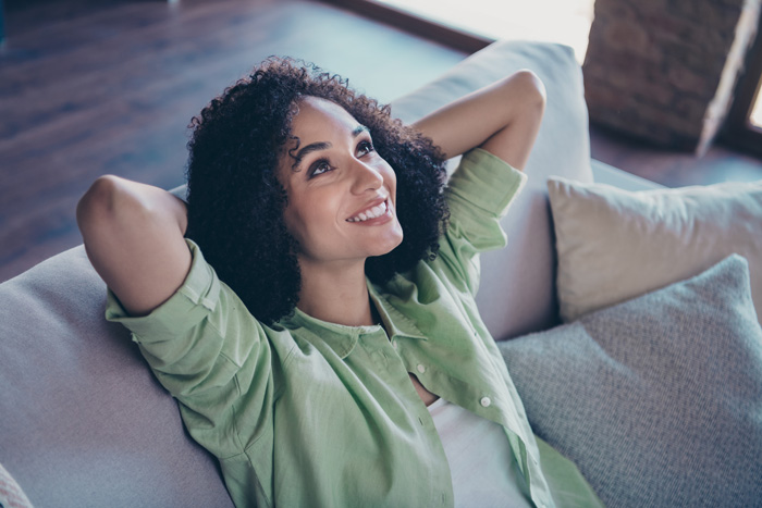 Cheerful woman who has attracted goodness and abundance into her life.