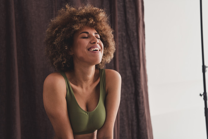 Young african American woman who is happy as she has chosen herself.