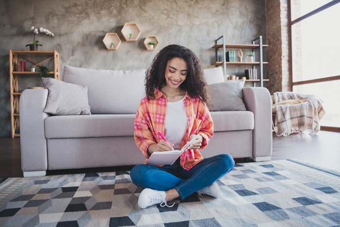 Young African-American woman finding resources to help rewrite her life script. Young African-American woman finding resources to help rewrite her life script.