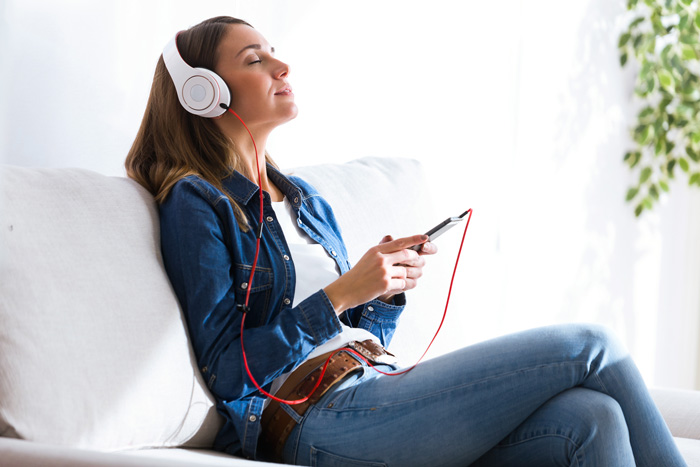 woman accessing theta brain waves with binaural beats. woman accessing theta brain waves with binaural beats.
