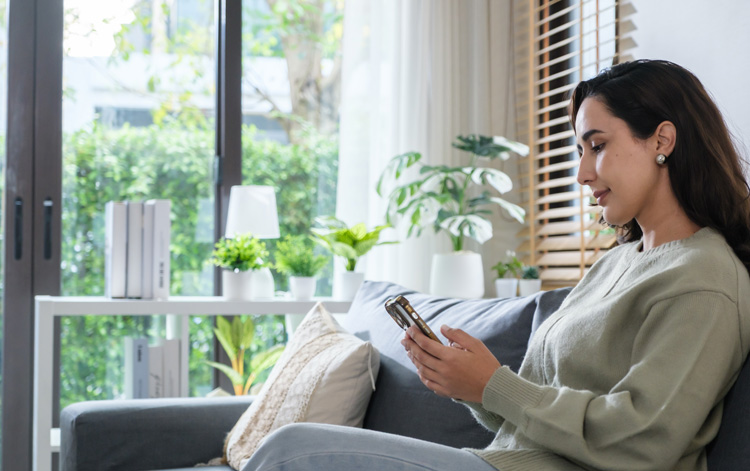 Woman writer relaxing on couch with aromatherapy.