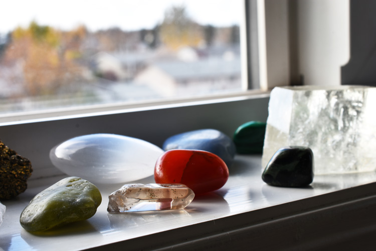 Healing crystals recharging on a sunny window sill.