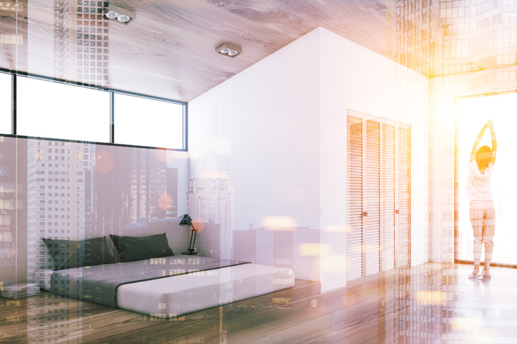 Woman balancing chakras in light from crystal suncatcher prism.