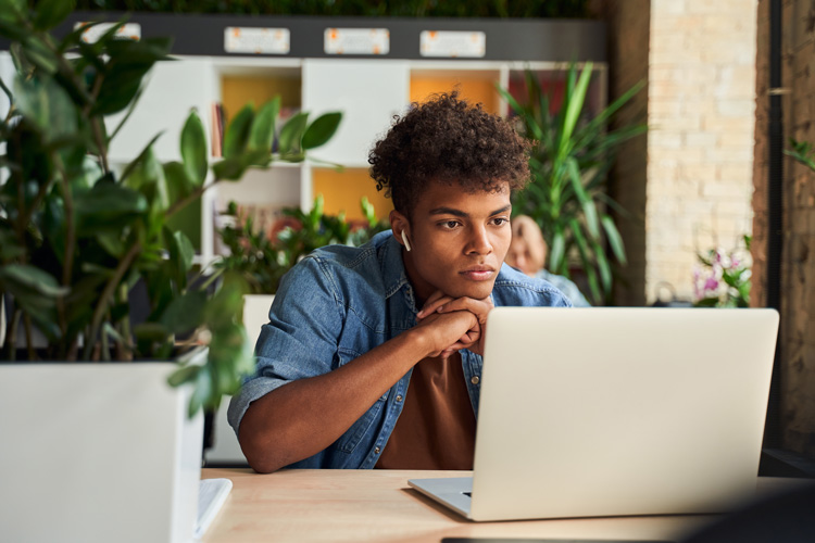 Young African-American guy taking immediate action. Not waiting for tomorrow.